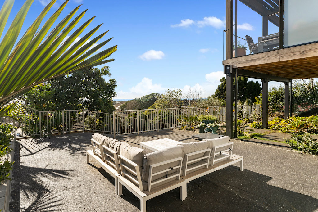 new build new plymouth two-storied house with tropical plants and view